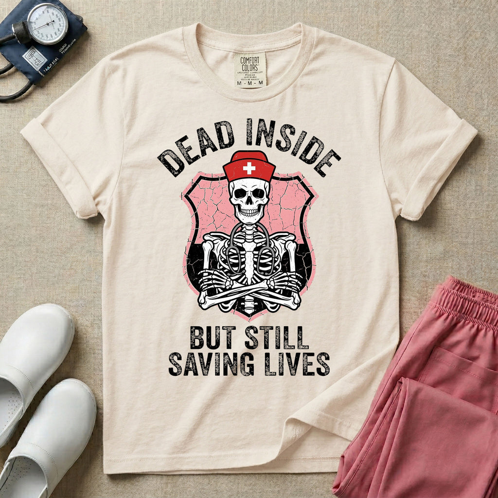 General nursing nurse t-shirt with a funny skeleton dead inside but still saving lives graphic in ivory color.