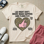 Labor and Delivery L&D nursing t-shirt featuring a leopard print heart diagram with a gloved thumbs-up and the text "L&D NIGHT SHIFT: WHERE MAGIC HAPPENS (AND FLUIDS FLY)"