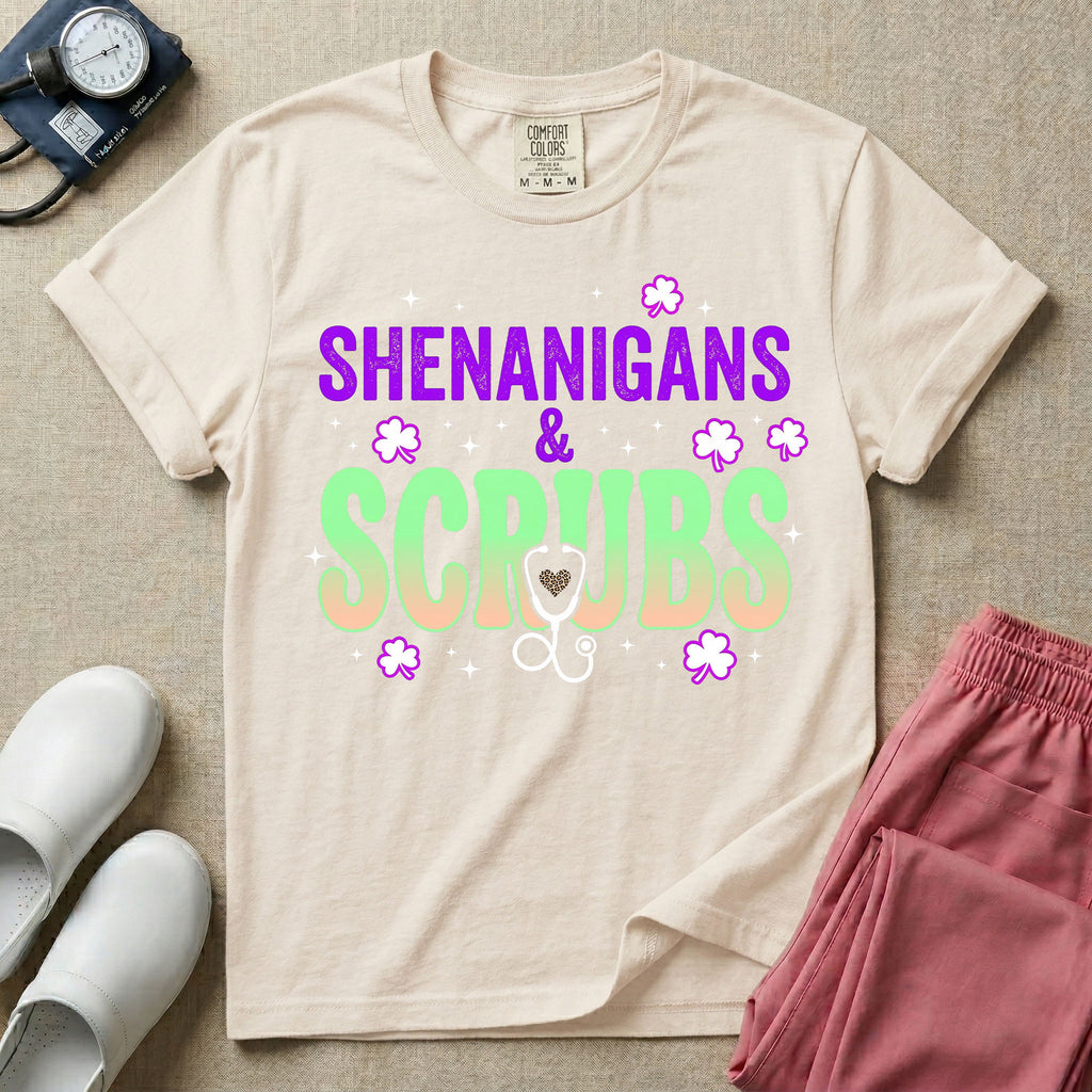 General nursing St. Patrick's Day t-shirt featuring a retro wavy font with the text "SHENANIGANS & SCRUBS" surrounded by shamrock graphics and a stethoscope.