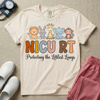 Neonatal Intensive Care Unit NICU RT respiratory therapist t-shirt featuring a row of cute cartoon animals including a lion, bunny, giraffe, elephant, and monkey sitting on the text "NICU RT" positioned above the cursive text "Protecting the Littlest Lungs".