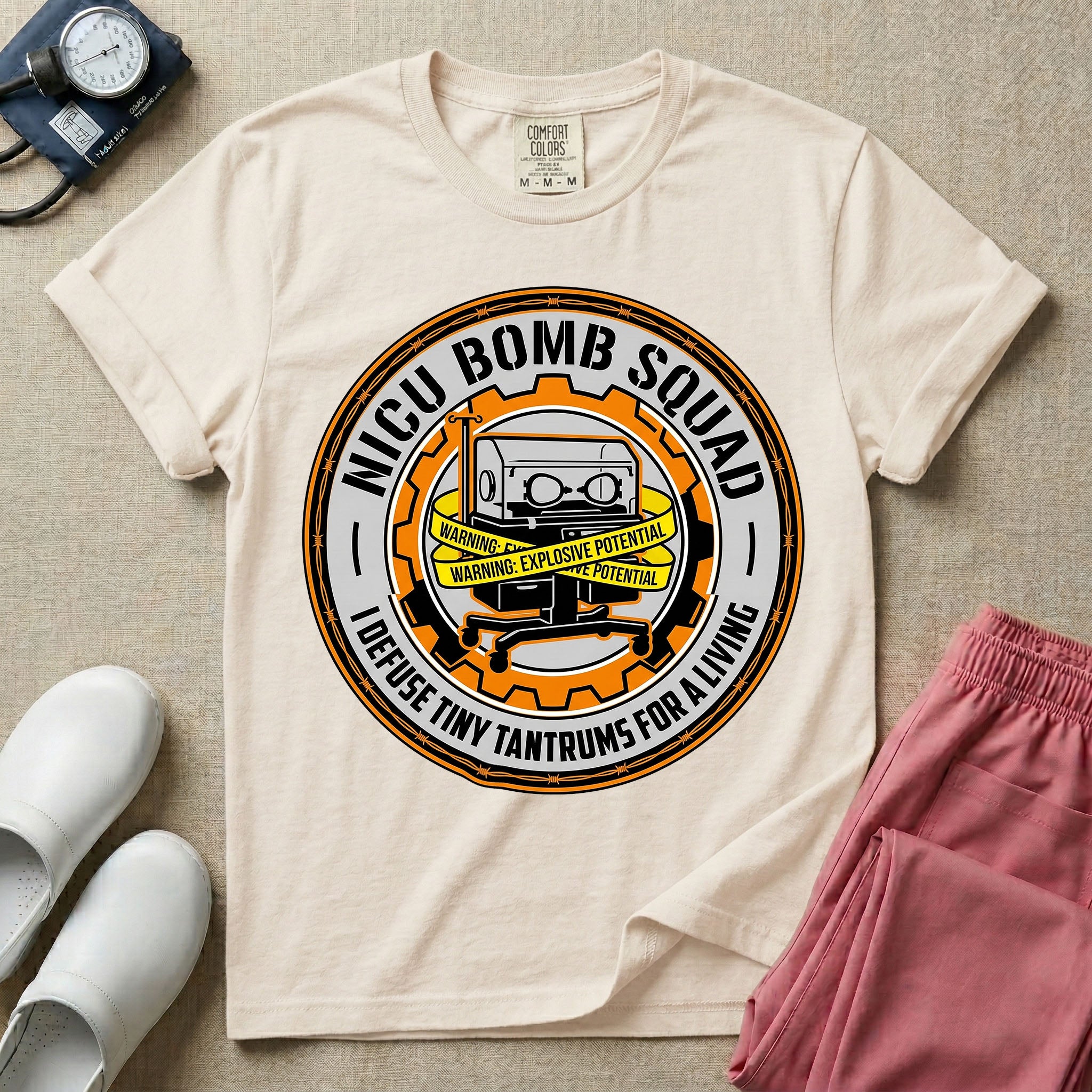 Neonatal Intensive Care Unit NICU nurse t-shirt with funny bomb squad defusing tiny tantrums graphic in ivory color.
