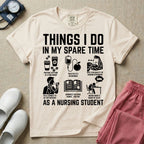 A t-shirt featuring the text THINGS I DO IN MY SPARE TIME AS A NURSING STUDENT surrounded by humorous line-art icons depicting studying, drinking coffee, and lacking sleep.