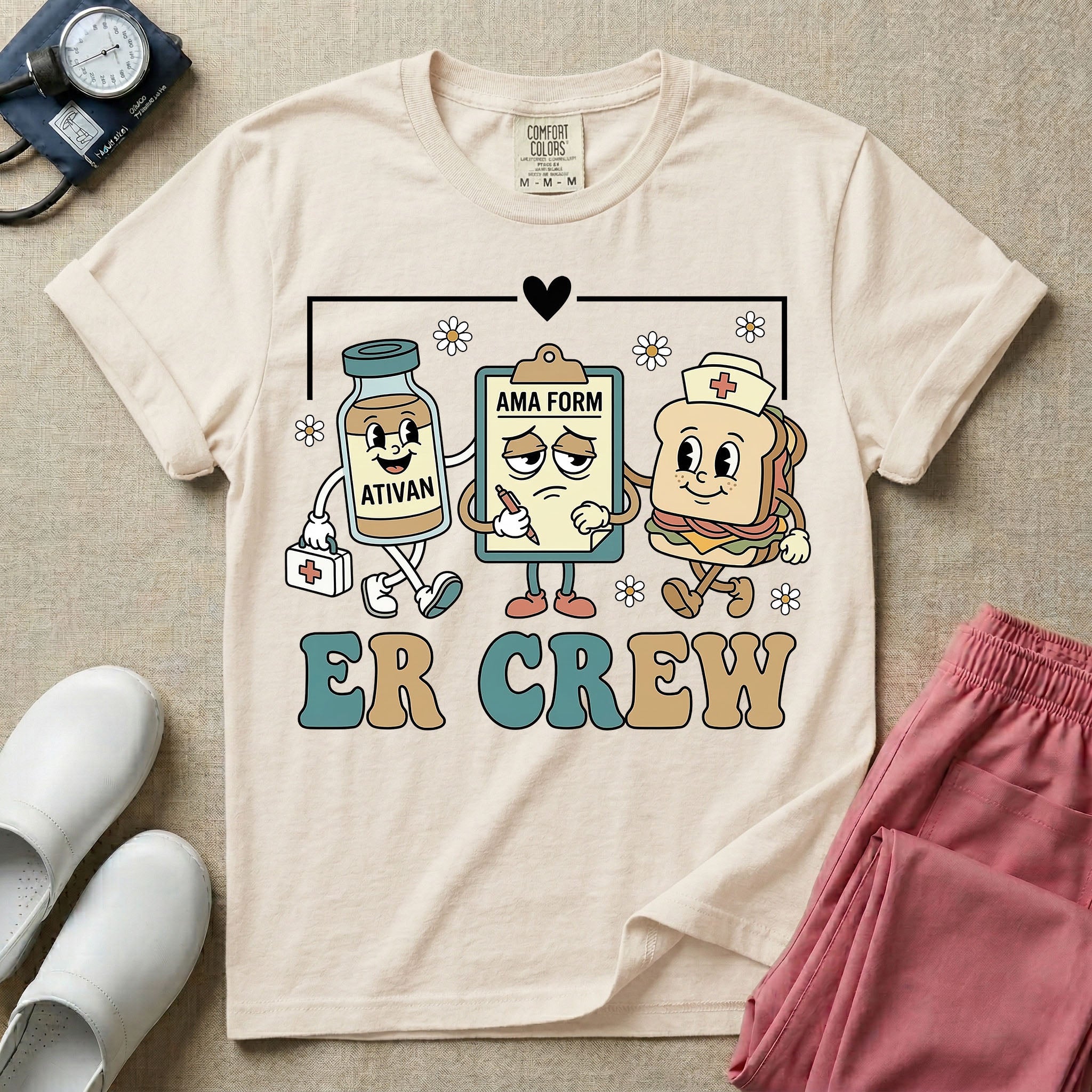 A retro-style t-shirt for emergency room nurses featuring the text "ER CREW" below a vintage cartoon illustration of a medicine bottle, a grumpy clipboard holding an AMA form, and a sandwich wearing a nurse cap walking together.
