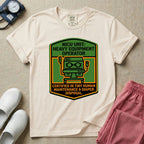 A graphic resembling a patch with green borders and orange inner sections featuring an illustration of a medical incubator in the center, with the text 'NICU UNIT: HEAVY EQUIPMENT OPERATOR' at the top and 'CERTIFIED IN TINY HUMAN MAINTENANCE & DIAPER DISPOSAL' at the bottom.
