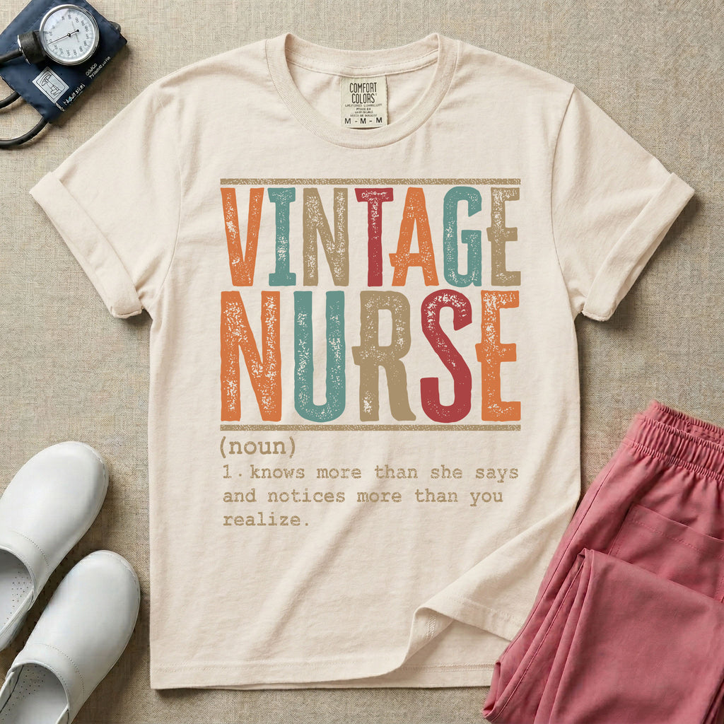 A humorous General Nursing graphic featuring large distressed retro-style block letters spelling VINTAGE NURSE, positioned above a dictionary-style definition in white typewriter font that reads (noun) 1. knows more than she says and notices more than you realize.