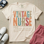A humorous General Nursing graphic featuring large distressed retro-style block letters spelling VINTAGE NURSE, positioned above a dictionary-style definition in white typewriter font that reads (noun) 1. knows more than she says and notices more than you realize.
