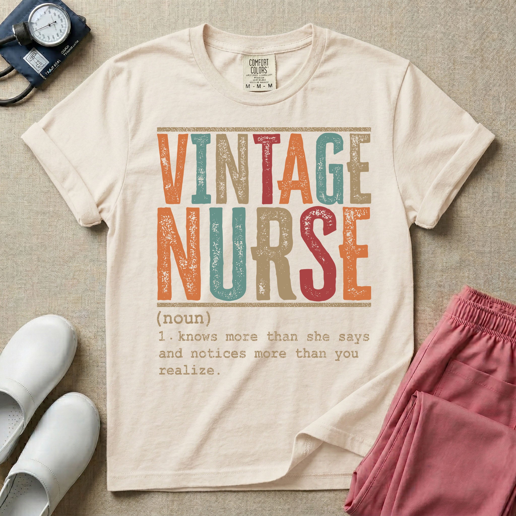 A humorous General Nursing graphic featuring large distressed retro-style block letters spelling VINTAGE NURSE, positioned above a dictionary-style definition in white typewriter font that reads (noun) 1. knows more than she says and notices more than you realize.