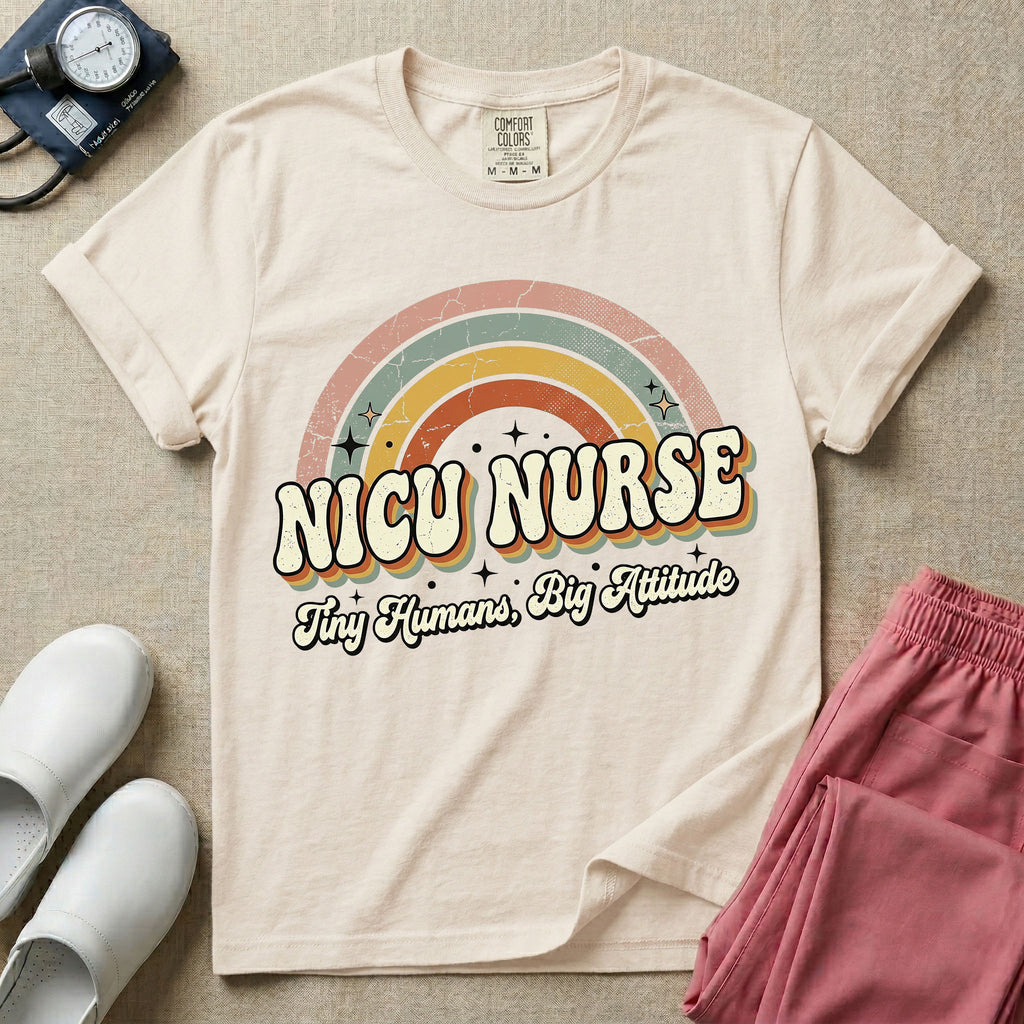 Neonatal Intensive Care Unit NICU nurse t-shirt with a retro vintage rainbow and tiny humans big attitude graphic in ivory color.