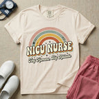 Neonatal Intensive Care Unit NICU nurse t-shirt with a retro vintage rainbow and tiny humans big attitude graphic in ivory color.