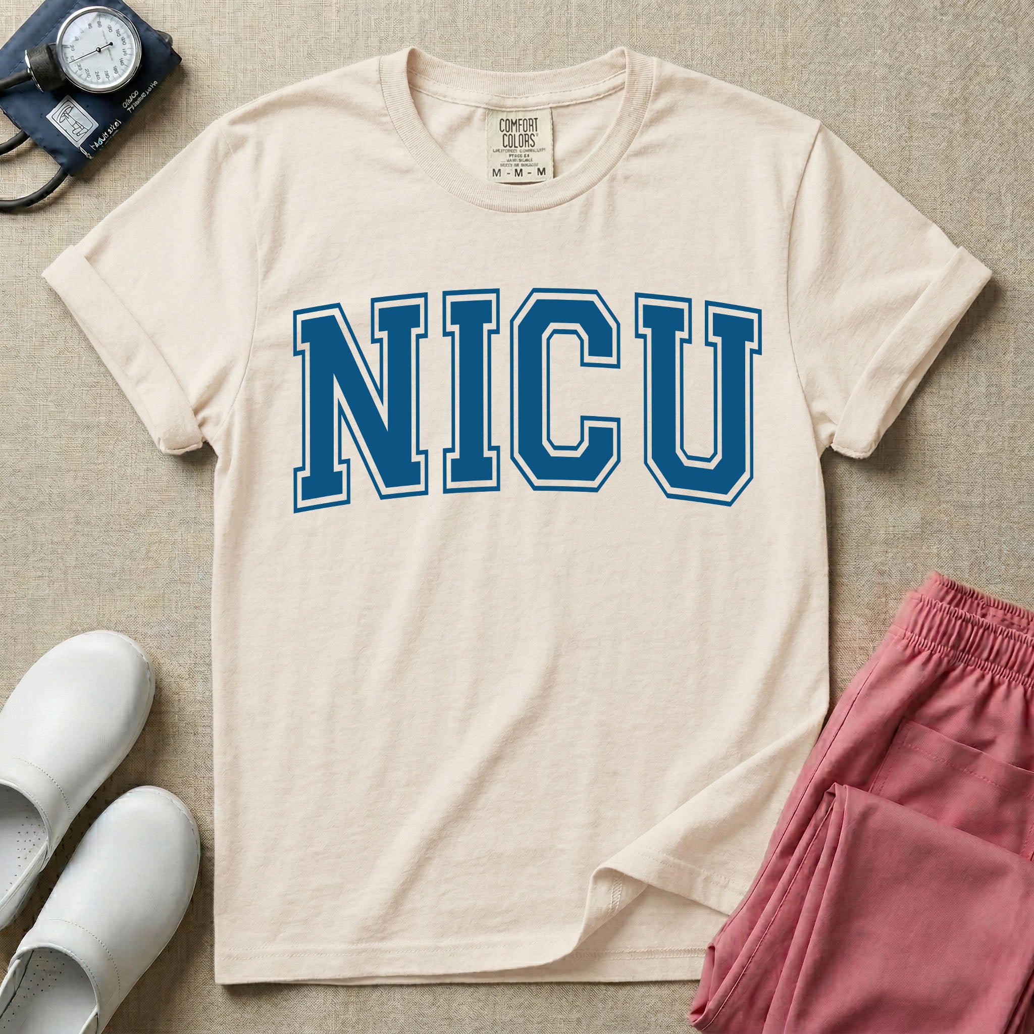 A minimalist graphic for the Neonatal Intensive Care Unit featuring the word 'NICU' printed in large, white, collegiate-style block letters across the chest.