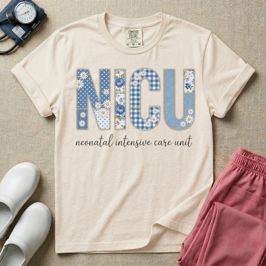 Neonatal Intensive Care Unit NICU nursing t-shirt featuring a faux-embroidery graphic of the letters NICU filled with blue floral and checkered patterns, positioned above the cursive text "neonatal intensive care unit".