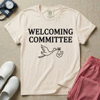 Labor and Delivery nurse graphic featuring a simple white outline of a flying stork carrying a baby bundle with a heart, placed below the text WELCOMING COMMITTEE.