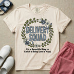 Labor and Delivery L&D nurse t-shirt with a boho floral wreath delivery squad catch a baby and a nap graphic in ivory color.