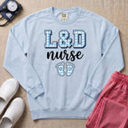 L&D Nurse Blue Gingham Footprints Sweatshirt - Chambray Comfort Colors Sweatshirt | HugTee