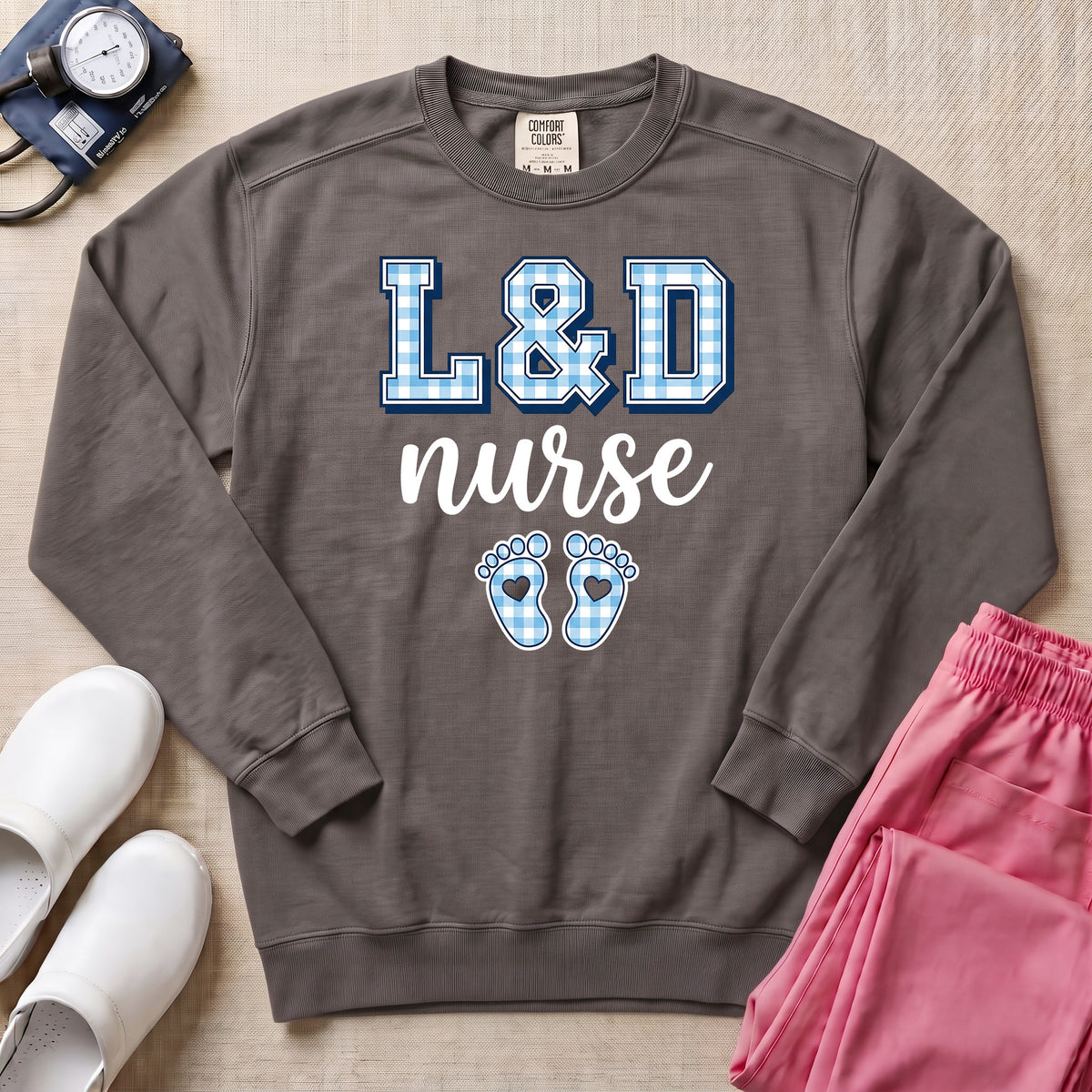 L&D Nurse Blue Gingham Footprints Sweatshirt - Pepper Lifestyle Hero Mockup | HugTee