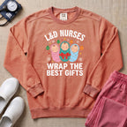L&D Nurses Wrap The Best Gifts Christmas Sweatshirt - Terracotta Comfort Colors Sweatshirt | HugTee