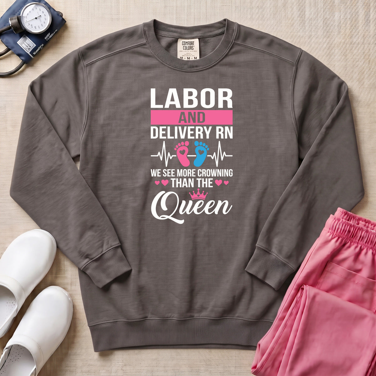 Funny Labor and Delivery RN Crowning Than The Queen Sweatshirt - Pepper Lifestyle Hero Mockup | HugTee