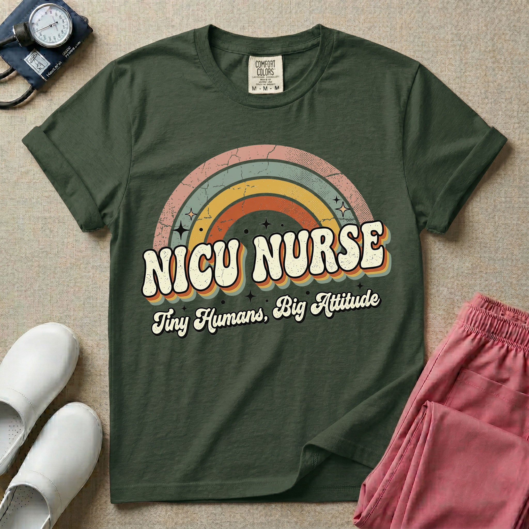 Neonatal Intensive Care Unit NICU nurse t-shirt with a retro vintage rainbow and tiny humans big attitude graphic in moss color.
