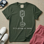 A funny minimalist ER nursing t-shirt featuring a white line drawing of an IV bag containing a coffee bean dripping into a mug labeled "night shift", sitting above the lower-case typewriter text "it's giving er nurse".