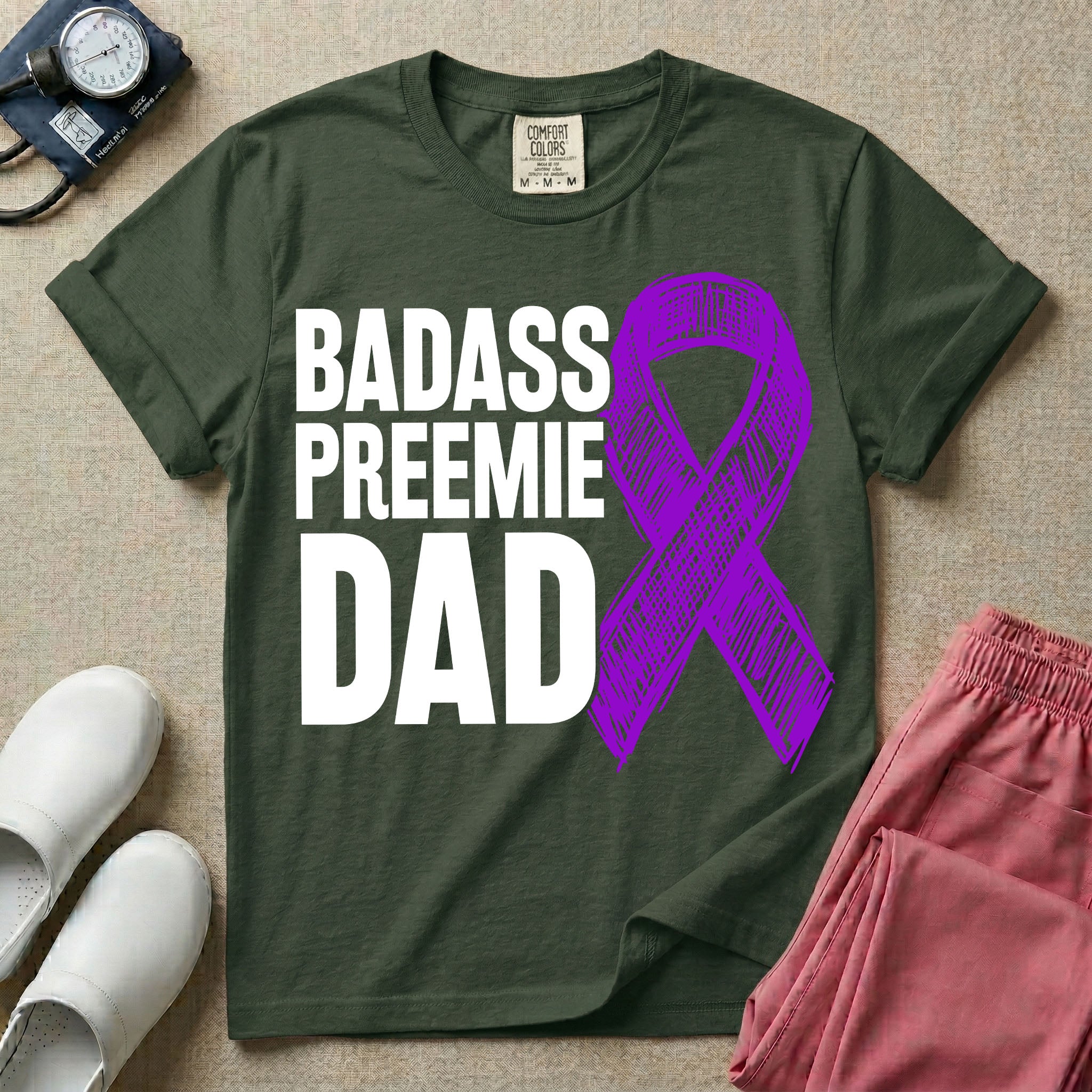 A graphic for the Neonatal Intensive Care Unit featuring the stacked, bold white text 'BADASS PREEMIE DAD' next to a large, textured purple awareness ribbon.