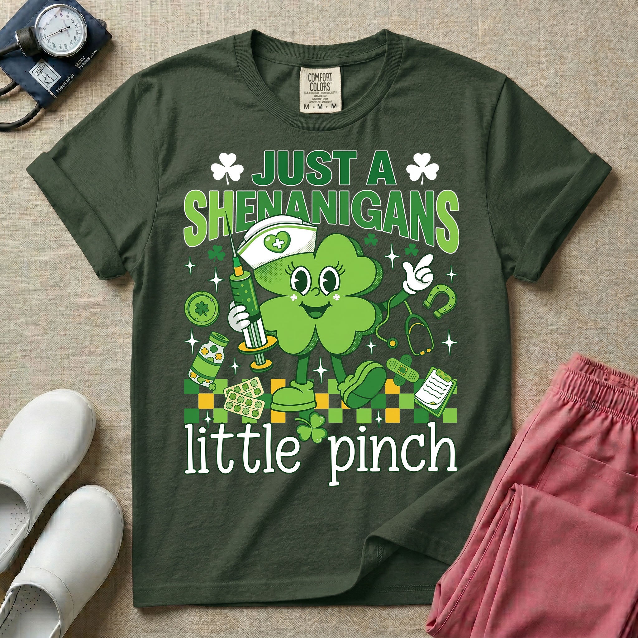 General nursing nurse t-shirt with a retro clover just a shenanigans little pinch graphic in moss color.