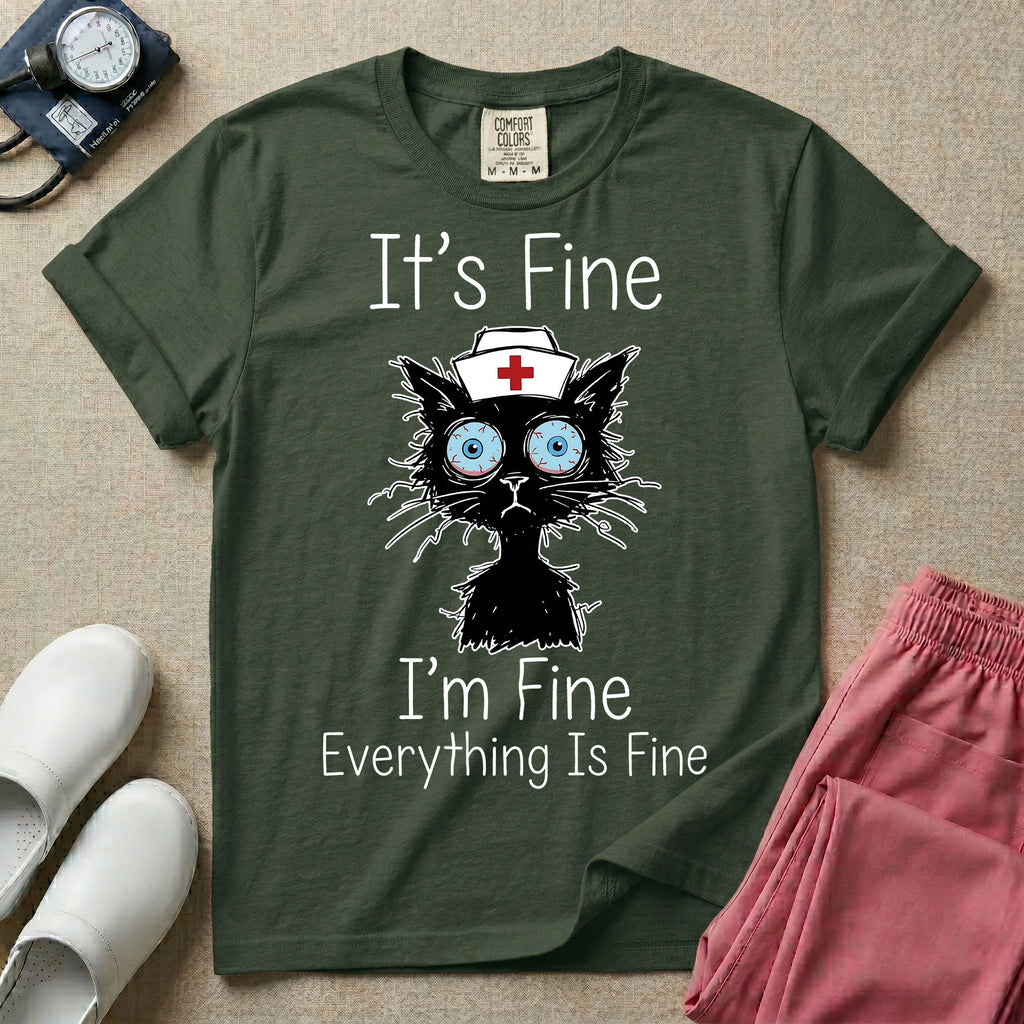 General nursing t-shirt featuring a humorous graphic of a frazzled black cat wearing a medical cross nurse cap alongside the text "It's Fine I'm Fine Everything Is Fine".