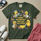 General nursing t-shirt featuring a chaotic group of cartoon ducklings dressed as medical professionals with the text "MOST DEFINITELY NOT ALL IN A ROW" on a sage green garment, in moss color.