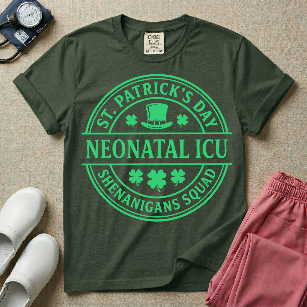 A circular green graphic featuring a leprechaun hat, shamrocks, and the text ST. PATRICK'S DAY SHENANIGANS SQUAD surrounding a center banner that reads NEONATAL ICU.