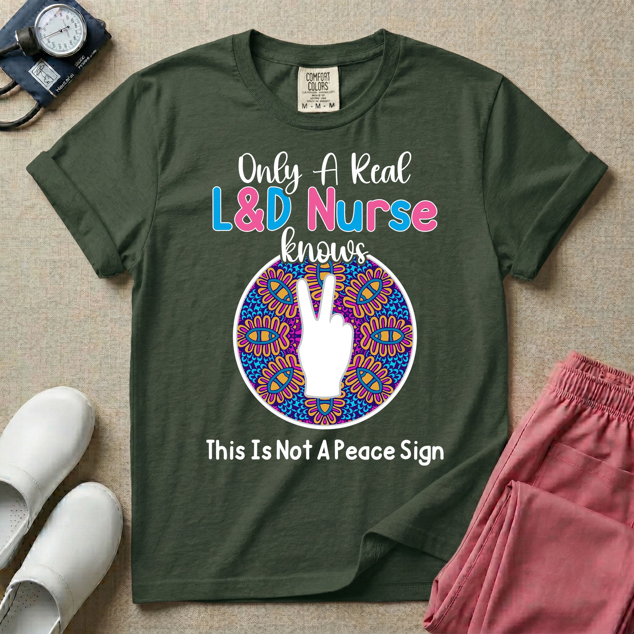 A humorous Labor and Delivery nurse graphic featuring a hand holding up two fingers inside a colorful boho mandala pattern, surrounded by text that reads Only A Real L&D Nurse Knows above and This Is Not A Peace Sign below.