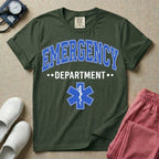 A classic varsity-style t-shirt for emergency room nurses featuring the word "EMERGENCY" in a large, arched blue collegiate font above the word "DEPARTMENT", centered over a blue Star of Life medical symbol.