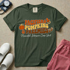 A t-shirt featuring the stacked text PACIFIERS PUMPKINS & PREEMIES in wavy orange, yellow, and brown retro lettering decorated with a pumpkin, pacifier, and baby footprints, with Neonatal Intensive Care Unit written in cursive below.