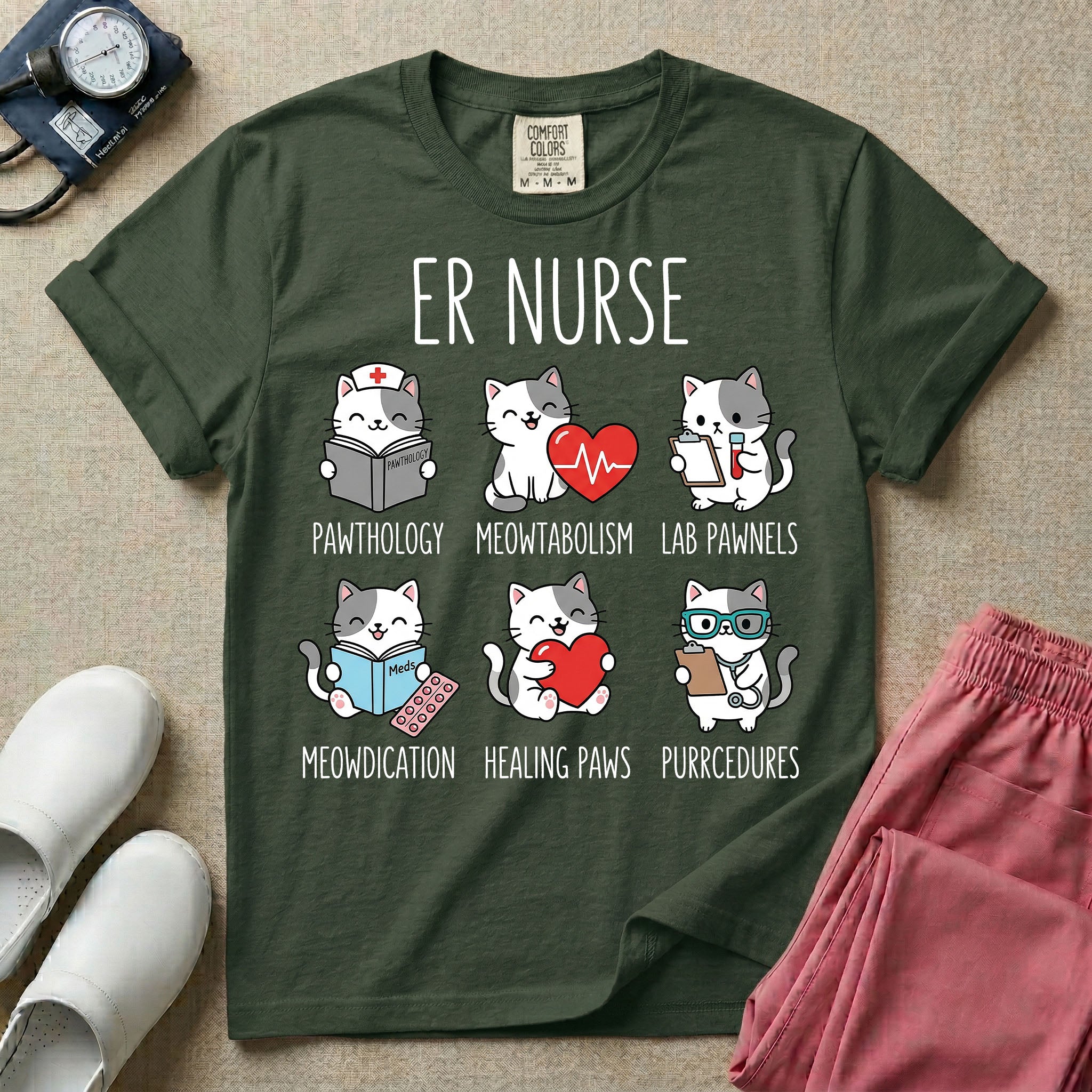 A funny t-shirt for emergency room nurses featuring the text "ER NURSE" above a grid of six cute cartoon cats demonstrating medical puns, including a cat reading for "PAWTHOLOGY", a cat with an ECG heart for "MEOWTABOLISM", a cat holding a test tube for "LAB PAWNELS", a cat with pills for "MEOWDICATION", a cat holding a heart for "HEALING PAWS", and a cat with a stethoscope for "PURRCEDURES".