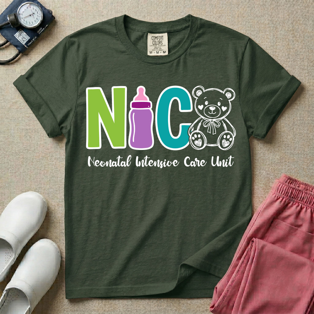 A t-shirt featuring the acronym NICU creatively spelled out using a green letter N, a purple baby bottle, a teal letter C, and a white outlined teddy bear, with the words Neonatal Intensive Care Unit written in cursive script below.