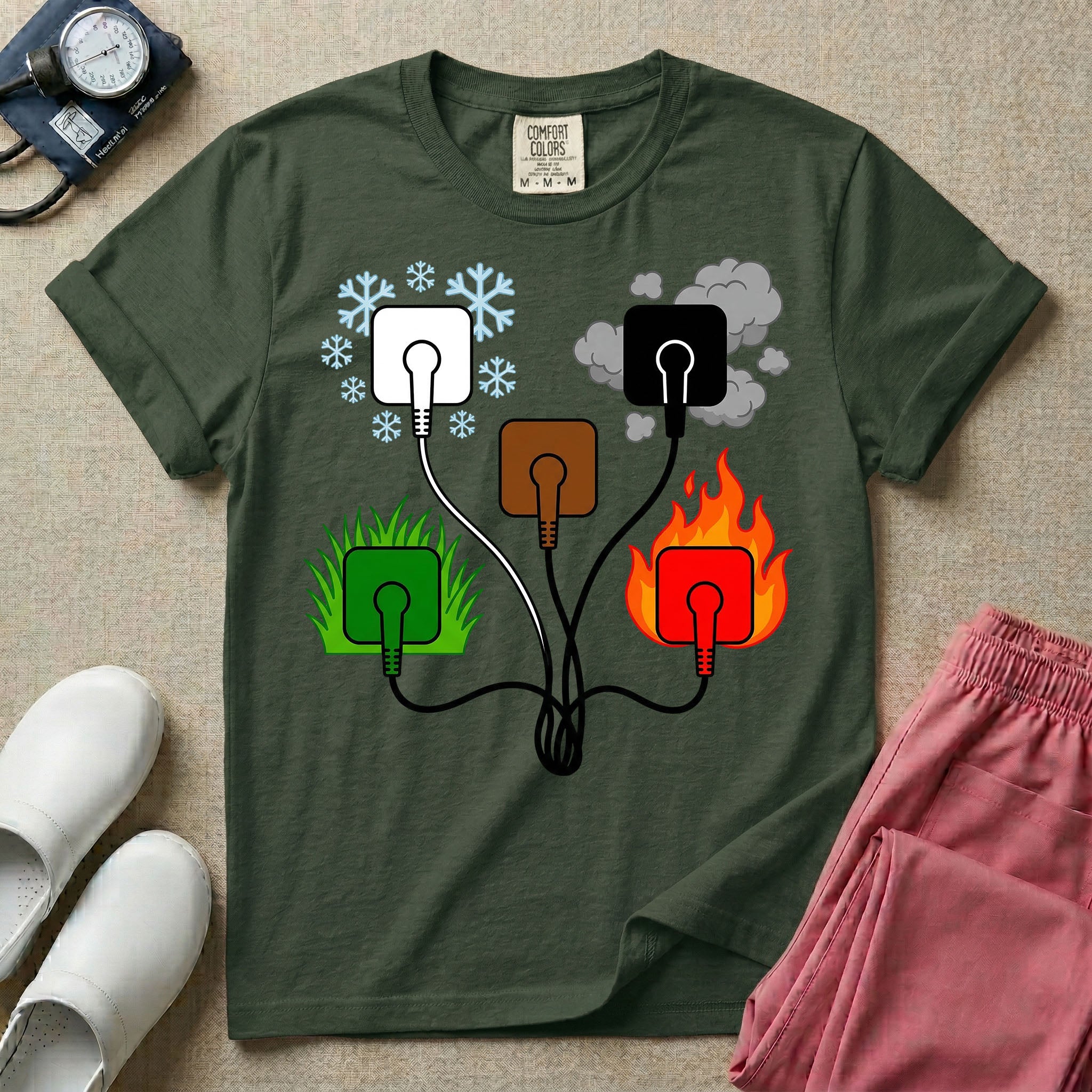 A minimalist t-shirt for nurses featuring an ECG lead placement mnemonic graphic with five connected electrical plugs, illustrating white snow over green grass, black smoke over red fire, and a central brown plug.