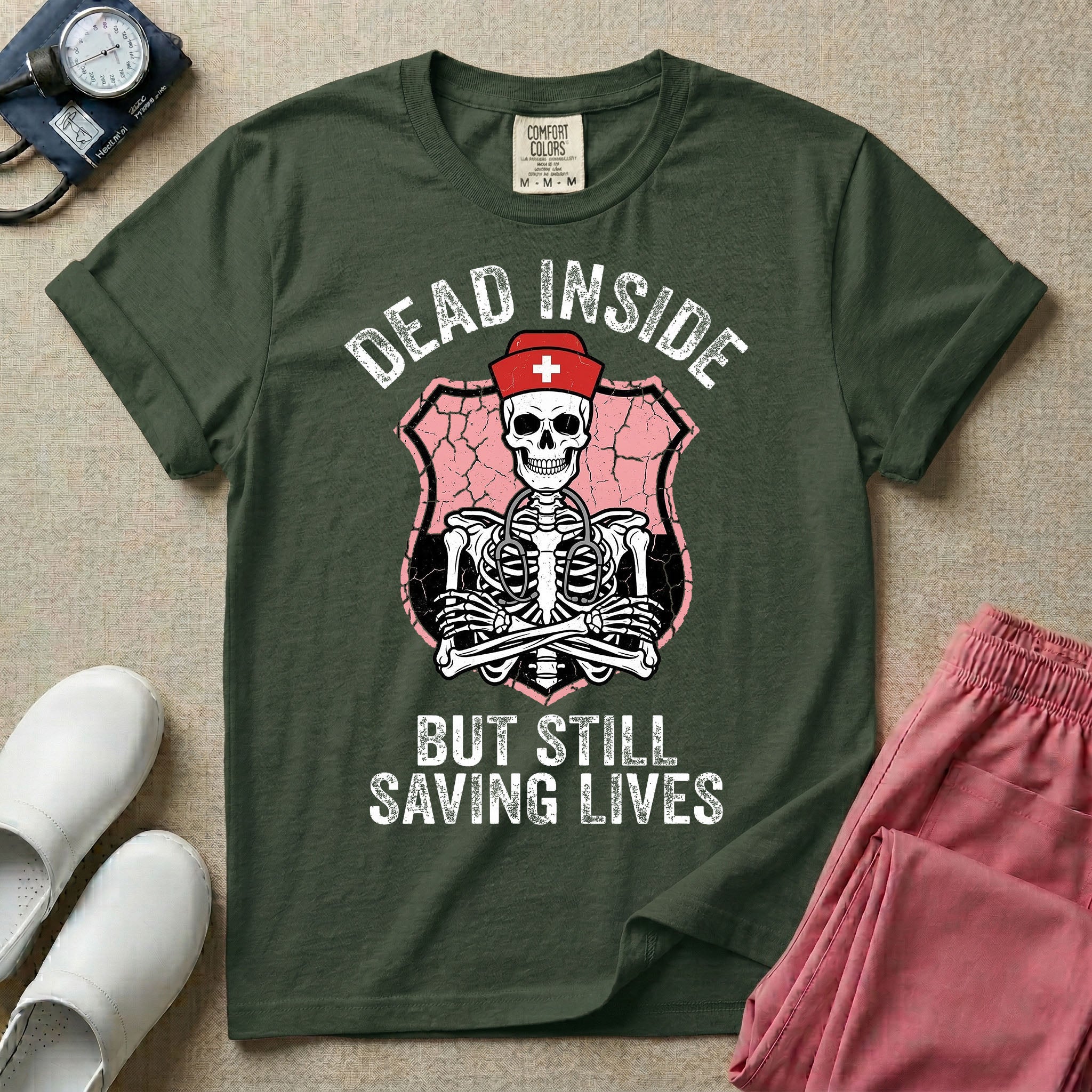 General nursing nurse t-shirt with a funny skeleton dead inside but still saving lives graphic in moss color.