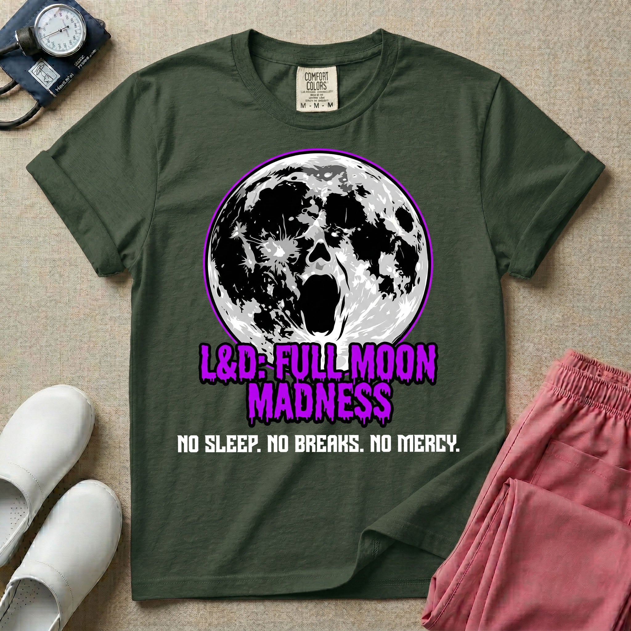 A humorous Labor and Delivery nurse graphic featuring a screaming face morphing out of a full moon, accompanied by purple dripping text that reads L&D: FULL MOON MADNESS and distressed black text below reading NO SLEEP. NO BREAKS. NO MERCY.