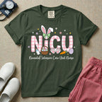 Neonatal Intensive Care Unit NICU nursing t-shirt featuring the letters NICU in a pink plaid pattern with bunny ears on the I, alongside a basket and Easter eggs, positioned above the cursive text "Neonatal Intensive Care Unit Nurse".
