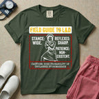 A humorous and retro graphic tee for labor and delivery nurses featuring a vintage nurse illustration alongside the text "FIELD GUIDE TO L&D", "STANCE: WIDE", "REFLEXES: SHARP", "PATIENCE: NON-EXISTENT", and "CAUTION: HIGH PROBABILITY OF UNPLANNED HYDROMASSAGE".