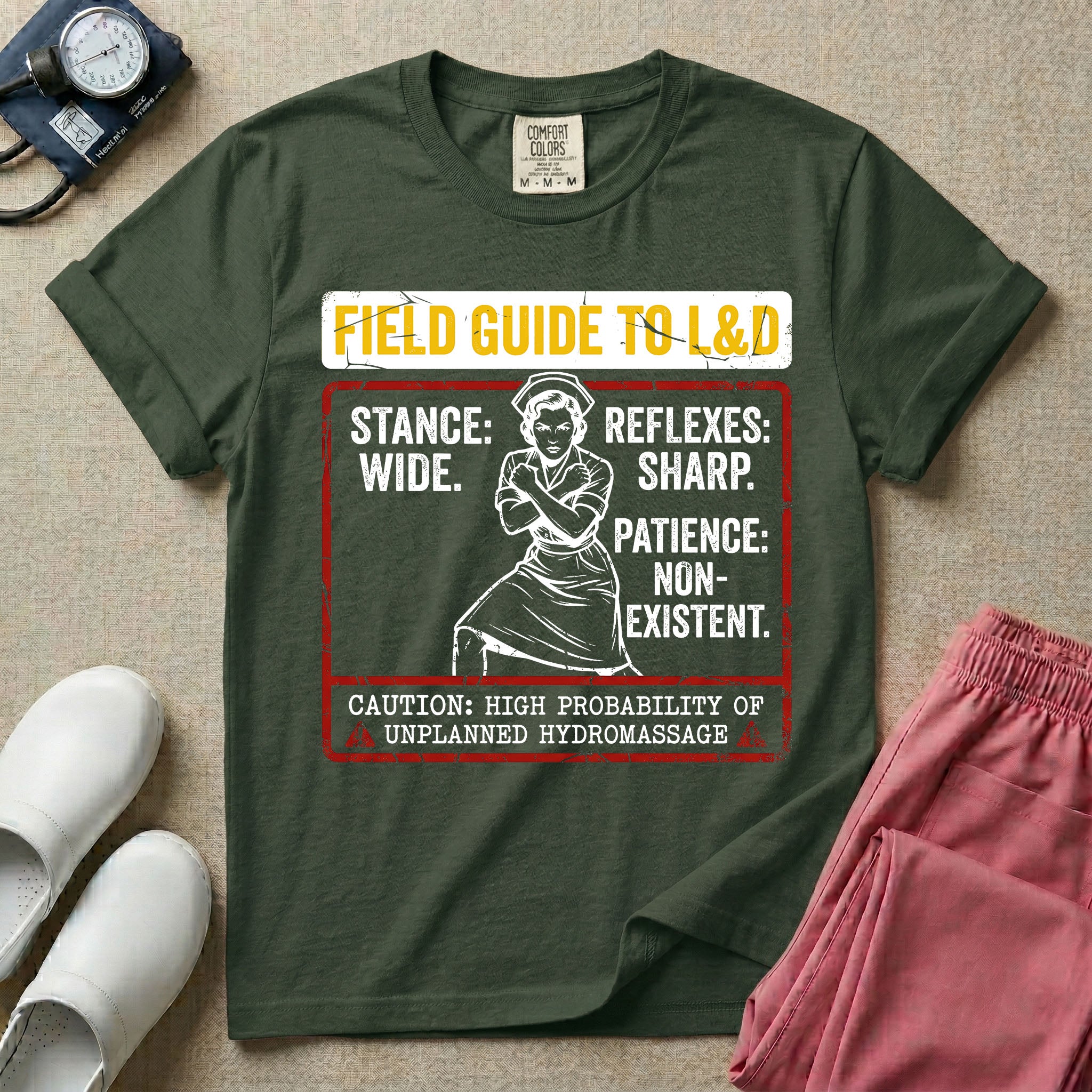 A humorous and retro graphic tee for labor and delivery nurses featuring a vintage nurse illustration alongside the text "FIELD GUIDE TO L&D", "STANCE: WIDE", "REFLEXES: SHARP", "PATIENCE: NON-EXISTENT", and "CAUTION: HIGH PROBABILITY OF UNPLANNED HYDROMASSAGE".