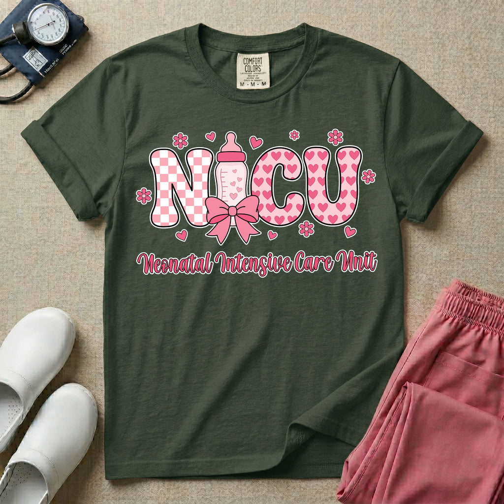 Retro coquette style t-shirt graphic featuring decorative pink 'NICU' text with checkerboard and heart patterns, incorporating a baby bottle with a bow and hearts, and the cursive text 'Neonatal Intensive Care Unit' below.