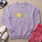Retro Neonatal Nurse Smiley Face NICU Sweatshirt - Orchid Comfort Colors Sweatshirt | HugTee