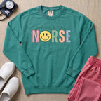 Retro Neonatal Nurse Smiley Face NICU Sweatshirt - Seafoam Comfort Colors Sweatshirt | HugTee