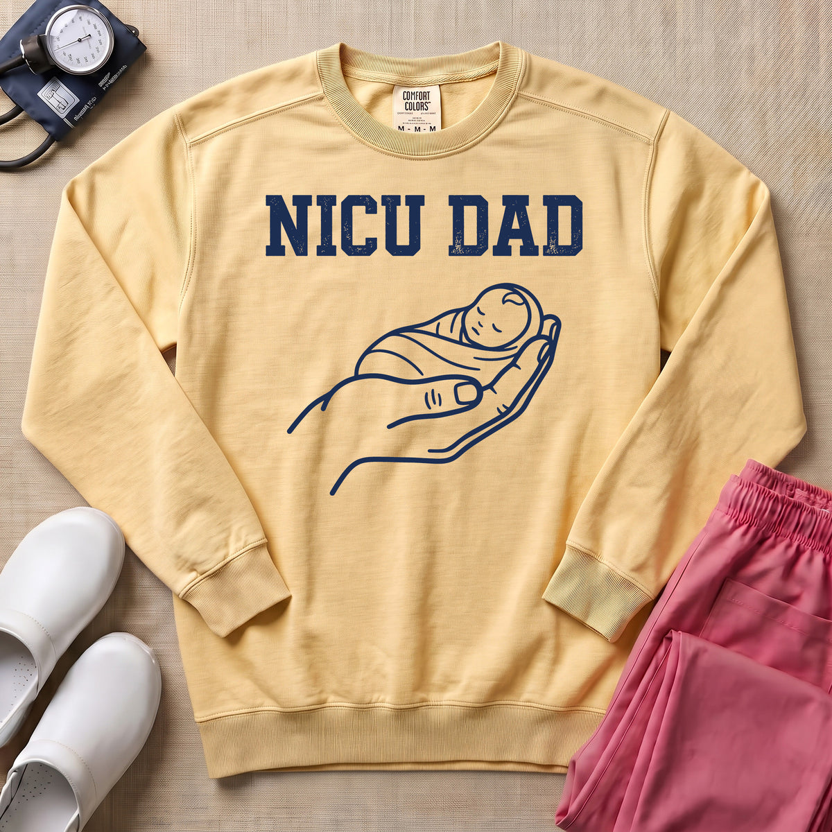 Proud NICU Dad Cradling Baby Line Art Minimalist Sweatshirt - Butter Comfort Colors Sweatshirt | HugTee