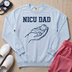 Proud NICU Dad Cradling Baby Line Art Minimalist Sweatshirt - Chambray Comfort Colors Sweatshirt | HugTee