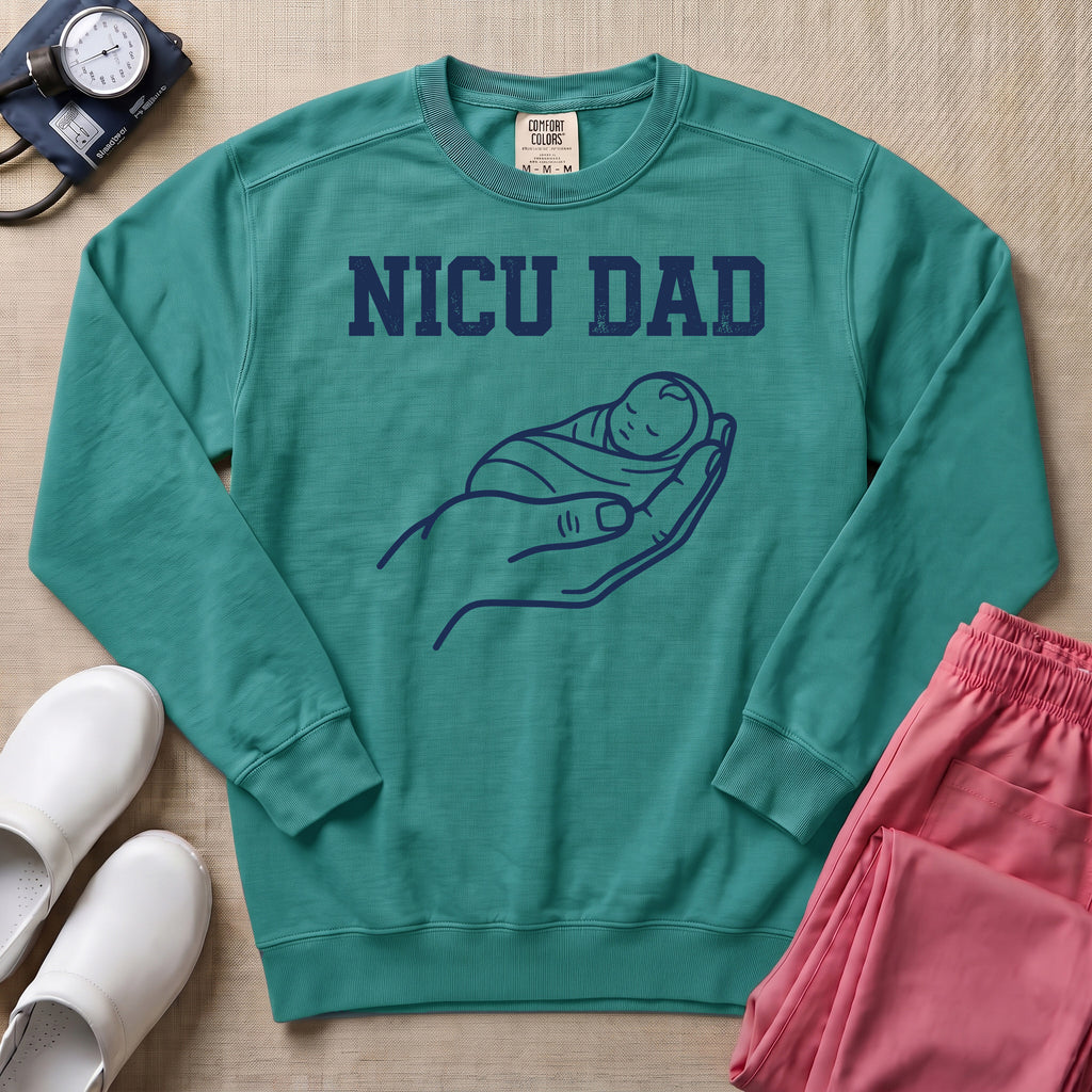 Proud NICU Dad Cradling Baby Line Art Minimalist Sweatshirt - Seafoam Comfort Colors Sweatshirt | HugTee