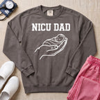 Proud NICU Dad Cradling Baby Line Art Minimalist Sweatshirt - Pepper Lifestyle Hero Mockup | HugTee