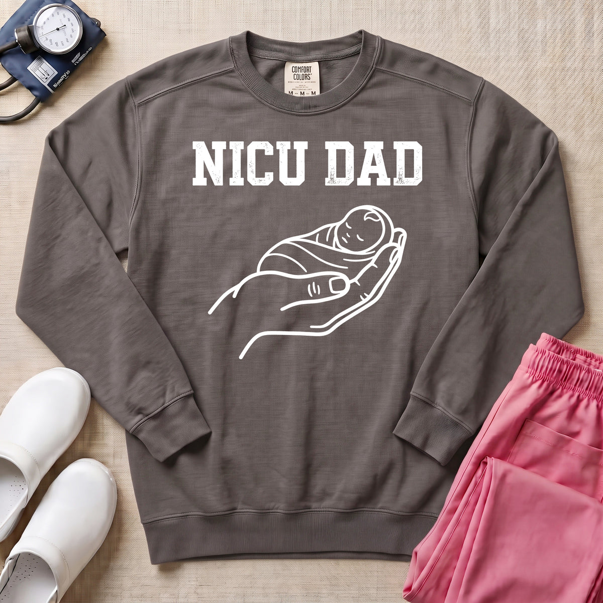 Proud NICU Dad Cradling Baby Line Art Minimalist Sweatshirt - Pepper Lifestyle Hero Mockup | HugTee