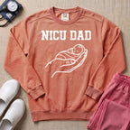 Proud NICU Dad Cradling Baby Line Art Minimalist Sweatshirt - Terracotta Comfort Colors Sweatshirt | HugTee
