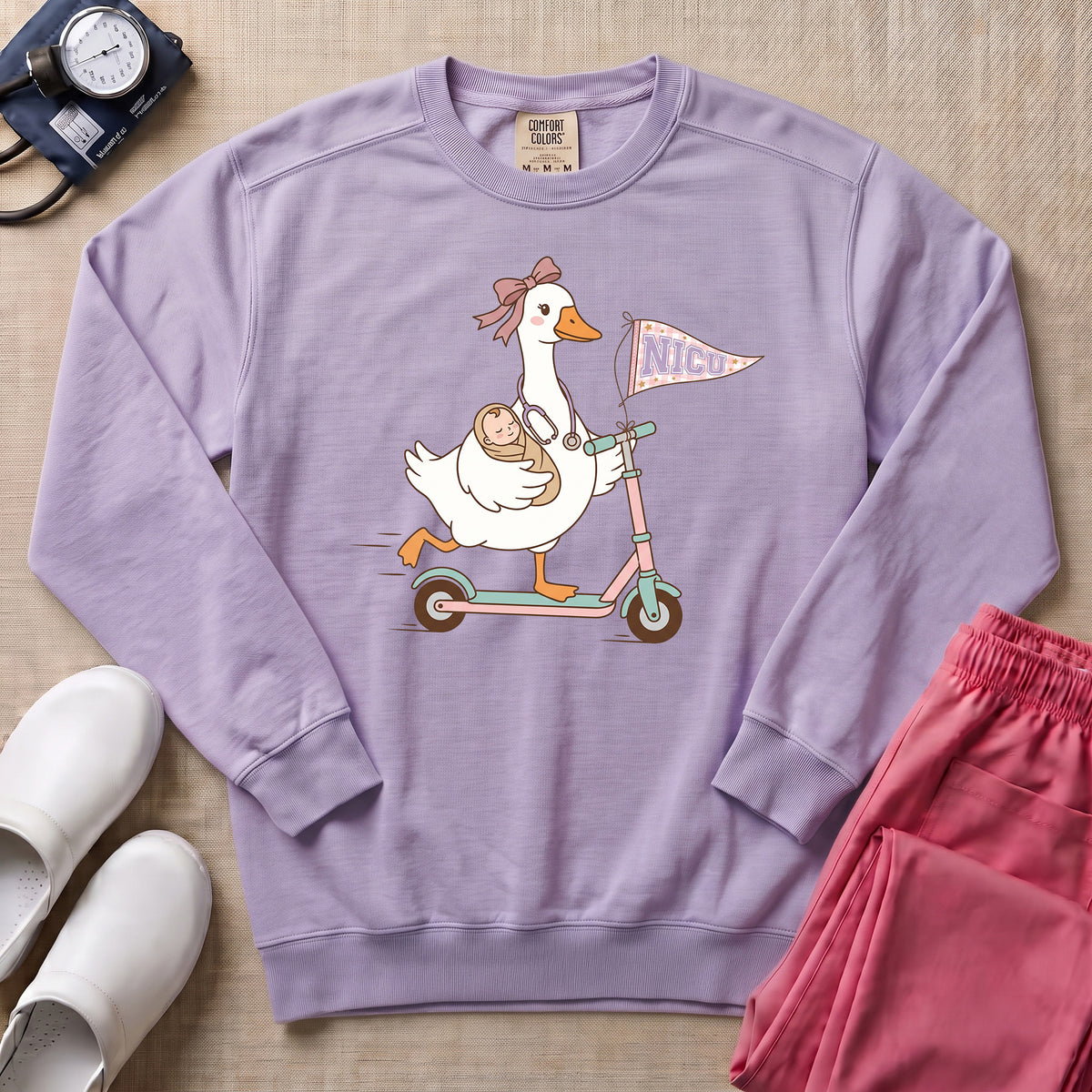 Coquette Goose Riding Scooter NICU Nurse Sweatshirt - Orchid Comfort Colors Sweatshirt | HugTee