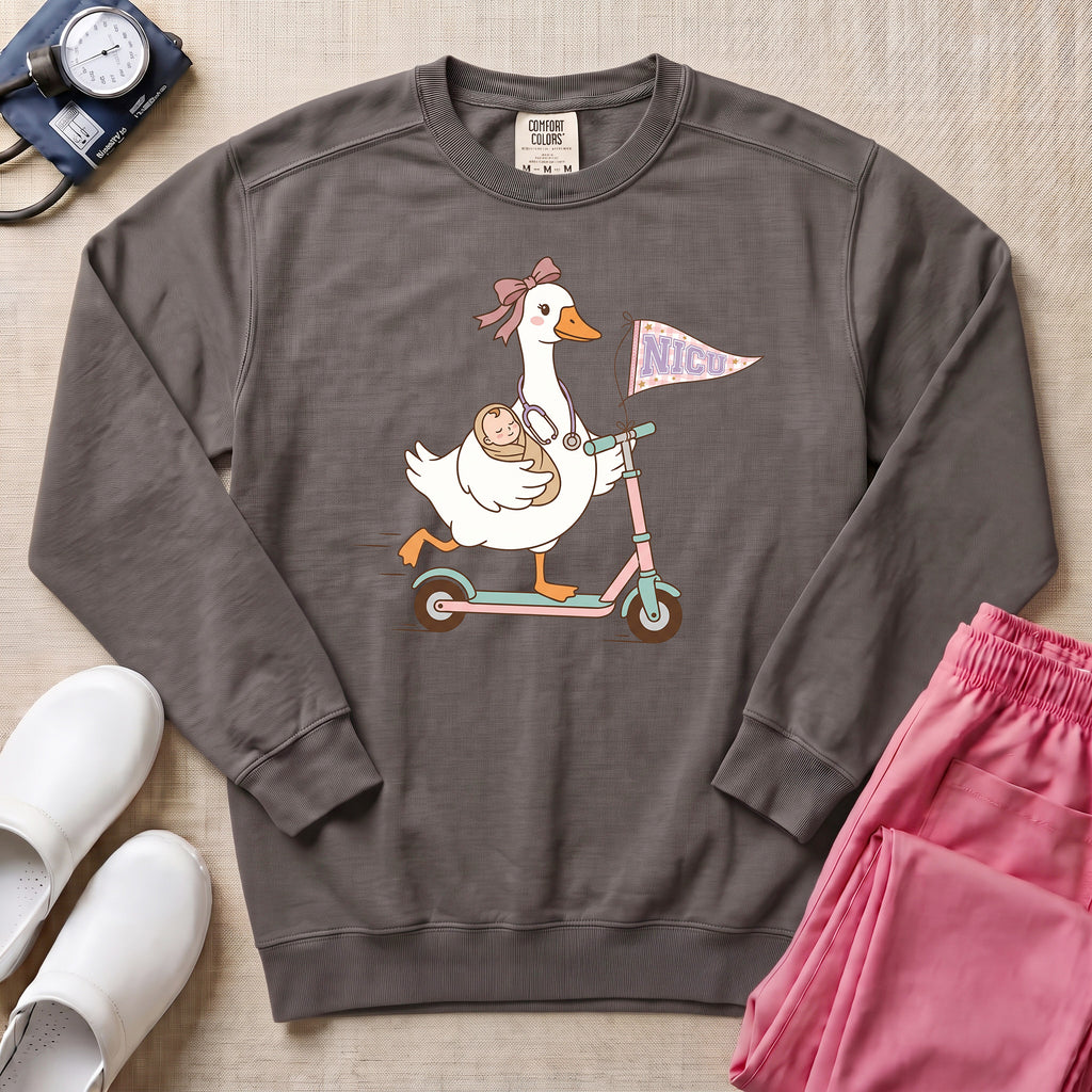 Coquette Goose Riding Scooter NICU Nurse Sweatshirt - Pepper Lifestyle Hero Mockup | HugTee